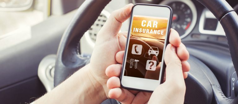 Car,Insurance,Concept,,Driver,Reading,Website,On,Smartphone