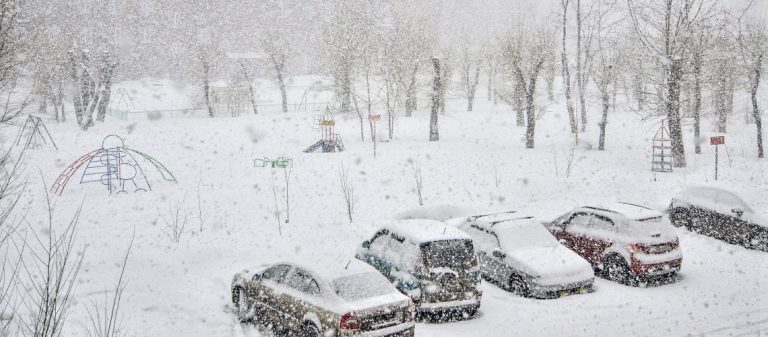 Heavy,Blizzard,In,Town.,Cars,With,Snow,Covered,On,Parking