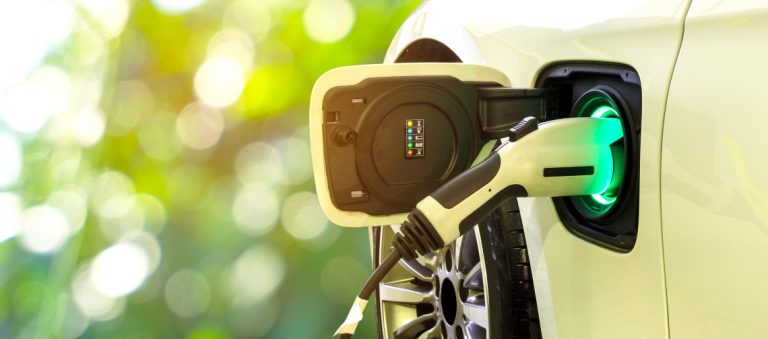 Ev,Car,Or,Electric,Car,At,Charging,Station,With,The