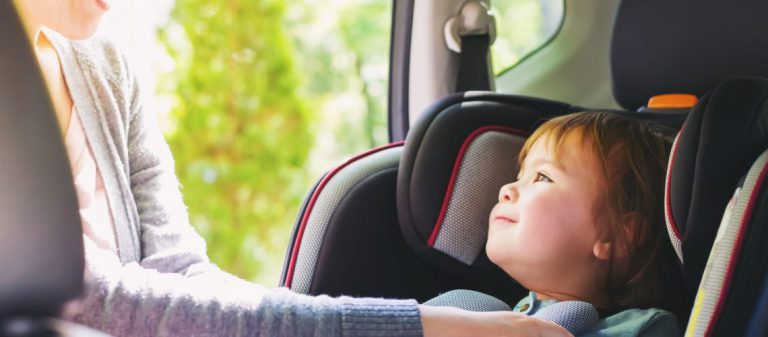 Toddler,Girl,Buckled,Into,Her,Car,Seat