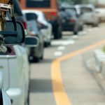 Cars,Parked,On,An,Asphalt,Road,For,Long-distance,Travel,Or